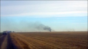 Smoke from a crashed military plane from NAS Whidbey Island rises from a farm field  in Eastern Washington this morning. KOMO
