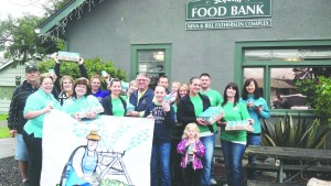 Sound Community Bank and city of Sequim staffers collected 512 jars of peanut butter for the Sequim Food Bank from donors during the Irrigation Festival Parade on May 11. Back row from left are Stephen Rosales