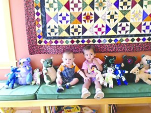 Griffin and Momoka Bartsch were the first to pick out a teddy bear from a box donated to First Step Family Support Center by inmates at Clallam Bay Corrections Center who made the toys through the Bears From Behind Bars Program.