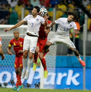 United States' Omar Gonzalez (3) and Jermaine Jones head the ball against Belgium's Jan Vertonghen during the World Cup round of 16 soccer match between Belgium and the USA at the Arena Fonte Nova in Salvador