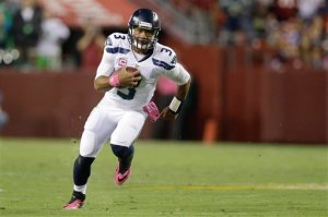 Seattle Seahawks quarterback Russell Wilson scrambles during Monday night's game against the Washington Redskins in Landover