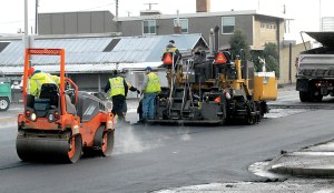Paving work continued Wednesday at the site of a water main break in Port Angeles. Keith Thorpe/Peninsula Daily News