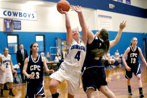 Chimacum's Mechelle Nisbet (4) is fouled while going up for a basket against Cedar Park's Nicole Kaufman at Chimacum High School. Steve Mullensky/for Peninsula Daily News