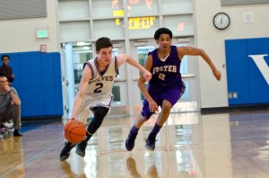 Sequim guard Anthony Pinza dribbles upcourt against the defense of Foster's Thomas Joseph. Jesse Major/for Peninsula Daily News