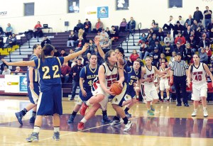 Neah Bay's Fay Chartraw (22) drives to the hoop against Wellpinit. Chartraw had a game-high 22 points. Lonnie Archibald/for Peninsula Daily News