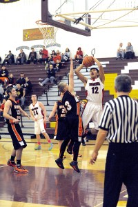 Neah Bay's Josiah Greene (12) puts up a shot over Wishkah Valley's Keigan Gardiner. Lonnie Archibald/for Peninsula Daily News