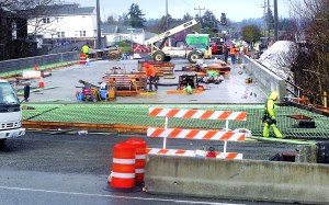 Work continues Wednesday on the Lauridsen Boulevard bridge over Peabody Creek in Port Angeles. Keith Thorpe/Peninsula Daily News