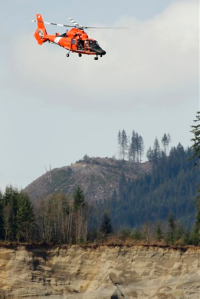 A Coast Guard MH-65 Dolphin helicopter from the Port Angeles air station