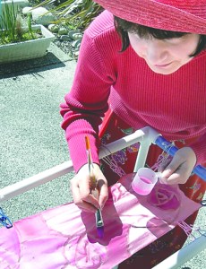 Sequim artist Renne Brock-Richmond hand-paints silk scarves for the May Day Opulent Art Show