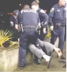 A screen shot of a video shot by a patron of The Oasis Bar and Grill in Sequim shows police subduing Morgan Weimer. Herbert Price