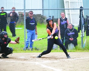Quilcene's Sammy Rae blasts a two-run home run during the Rangers' 10-0 victory in game 1 of a doubleheader with Highland Christian. Rae also threw her third no-hitter of the season in the game. Quilcene won the second game 9-3. Steve Mullensky/for Peninsula Daily News