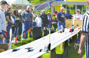 Spectators at the 2011 Brinnon ShrimpFest watch modified belt sanders fly down a custom track. After a year's hiatus