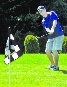 Sequim's Jack Shea aims for the pin on the first hole at Cedars at Dungeness Golf Course during the Olympic League golf championship earlier this month. Keith Thorpe/Peninsula Daily News