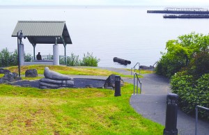 A park user looks out at the water of Port Angeles Harbor from the pavilion at Francis Street Park in Port Angeles on Thursday. The park was reopened Wednesday after being closed for sewer line work as part of the city's combined sewer outflow project. Keith Thorpe/Peninsula Daily News