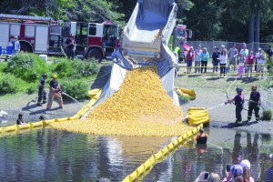 The 25th Great Olympic Peninsula Duck Derby gets underway in Port Angeles on Sunday with a little help from the city fire department. Dave Logan/for Peninsula Daily News