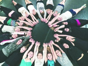 Clockwise from top center with long sleeves are O'Meara Dance Studio students Zoe Flanigan