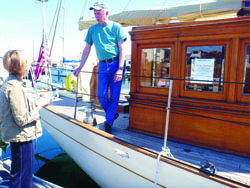 Lloyd Baldwin chats with Lorilee Houston at Point Hudson Marina in Port Townsend. Jennifer Jackson/for Peninsula Daily News