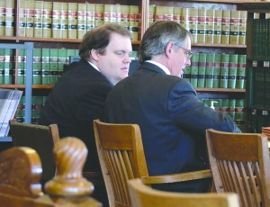Michael J. Pierce sits with his attorney istens as attorney Richard Davies asks questions during jury selection Tuesday. Charlie Bermant/Peninsula Daily News