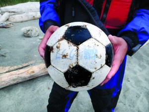 Writing on this ball identifies it as belonging to a Japanese soccer club. Ikkatsu Project