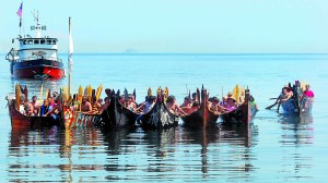 A flotilla of canoes representing the Quinault and Quileute tribes of the Pacific Coast
