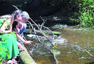 Jefferson Land Trust Conservation Projects Committee Chairman Owen Fairbank and staffer Caroline Robertson admire a stretch of Chimacum Creek that runs through the Illahee Preserve