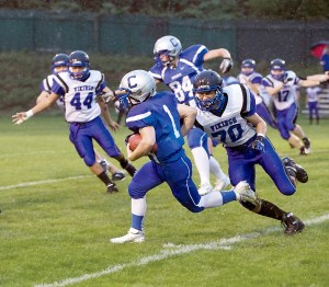 Chimacum's Drew Yackulic (1) runs for yardage against the Bellevue Christian Vikings last season. Yackulic will be a senior for the new-look Cowboys. Steve Mullensky/for Peninsula Daily News