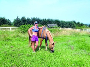 Lisa Preston pauses with her horse
