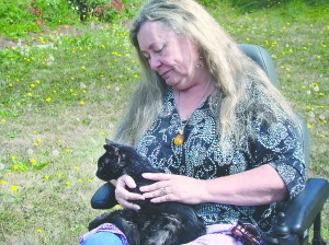 Kristi Li Fight gives a Reiki massage to Muttonchops