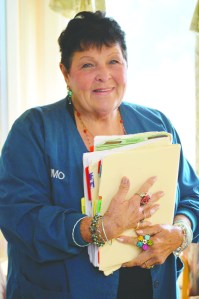 Volunteer receptionist Gerene Russell shepherds hundreds of patients at Port Angeles' free clinic. Diane Urbani de la Paz/Peninsula Daily News
