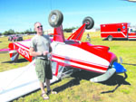 Dan Donovan of Sequim stands in front of the plans-built Bear Hawk he crash-landed at Sequim Valley Airport Sunday. Arwyn Rice/Peninsula Daily News