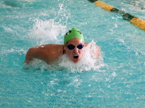 Janie Macias swims the breastroke during the 200 individual medley against Sequim. Macias took first in the event by swimming a state-qualifying time of 2:22.08. Patty Reifenstahl