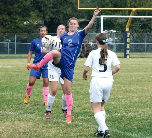 Chimacum's Sammy Rains (2) and Forks' Rani Banks (11) compete for the ball during the Cowboys' 6-1 win over the Spartans. Also in on the action are Chimacum's Nicole Cerna (14) and Forks' Caitlyn Wells (5). Lonnie Archibald/for Peninsula Daily News
