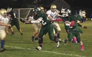 Port Angeles running back Miki Andrus follows blocker Nick Lasorsa upfield on an 8-yard gain in the third quarter of the Riders' 36-14 win over Bremerton Dave Logan/for Peninsula Daily News