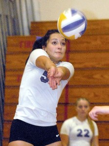 Sequim's McKenzie Bentz gets the bump in the first game of her team's match against Kingston on Tuesday night in Sequim. The Wolves fell 3-1. Keith Thorpe/Peninsula Daily News