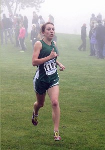 Elizabeth Stevenson led the Port Angeles girls team to victory with her fourth-place finish at the foggy Olympic League championship meet. Dave Logan/for Peninsula Daily News