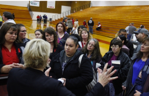 Marysville School District parents speak to Superintendent Dr. Becky Berg on Tuesday night after a community meeting at Marysville Pilchuck High School. Local school and community officials spoke to parents and answered questions regarding the school's plan to reopen in light of the shooting. The (Everett) Herald