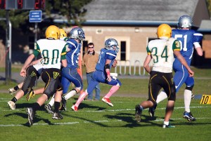 Chimacum's Alex Morris (5) sprints 4 yards to the end zone for the second of his touchdowns during the continuation of a game against the Vashon Pirates played at Chimacum High School. Steve Mullensky/for Peninsula Daily News
