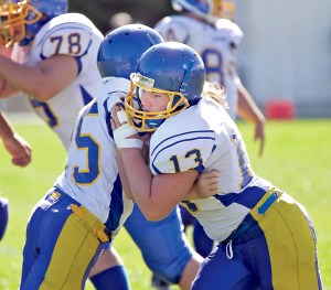 Crescent's Raine Westfall (13) practices with teammate Noah Leonard when the Loggers played at Quilcene last month. Westfall