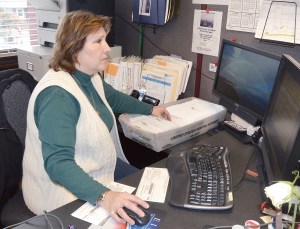 Jefferson County Elections Supervisor Betty Johnson checks some of the 2