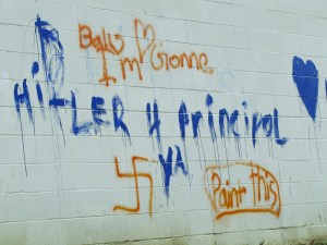 Port Angeles police believe middle-schoolers are behind this graffiti on the back wall of the gym at Stevens Middle School. Arwyn Rice\/Peninsula Daily News