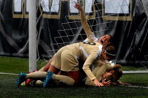 Teammates pile up on Ellie Small after she scored the winning goal for the Peninsula Pirates in the second overtime period against North Idaho in the NWAC quarterfinal game in Port Angeles. Joining in the dogpile were Michele Whan