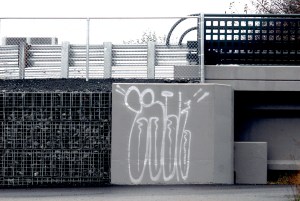The base of a new bridge over Ennis Creek at the former Rayonier mill site in Port Angeles sits defaced by graffiti. Keith Thorpe/Peninsula Daily News
