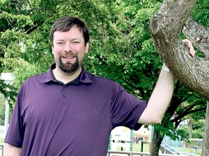 Troy McKelvey in front of the Port Townsend Community Center. After he was laid off