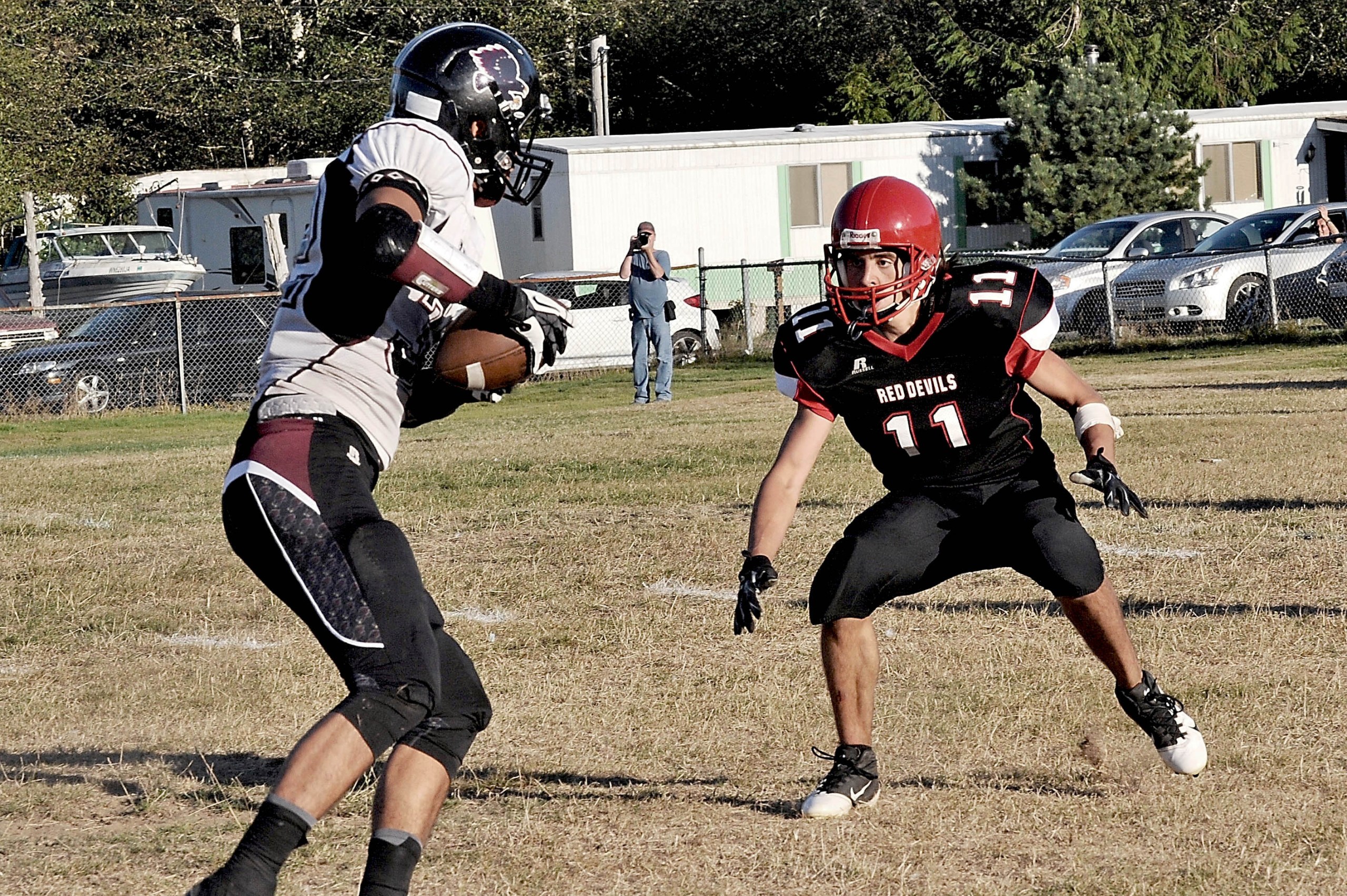 Neah Bay's Josh Monette (11) zeroes in on Lummi's Willie Jones during the first of the Red Devils' three wins over the Blackhawks this season. Monette