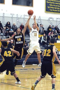 Forks' Billy Palmer (13) puts up a shot during the Spartans' season-opening loss to North Beach Lonnie Archibald/for Peninsula Daily News