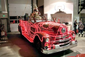A vintage 1956 Seagrave fire engine is decked out in lights. The truck will make the rounds of Port Angeles neighborhoods to hand out candy canes and collect food bank donations beginning Saturday. Dave Logan/for Peninsula Daily News