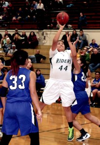 Port Angeles' Nizhoni Wheeler (44) shoots against Olympic's Ella Hazzard