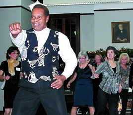 Lee Brown leads a flash mob that took guests by surprise at the Port Townsend Library holiday fete
