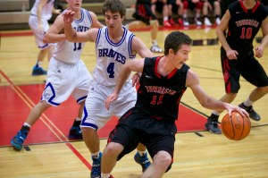 Port Townsend's Sean Dwyer (11) reverses direction around La Conner's Matt Finley during the small-school consolation game of the Crush in the Slush tournament at Port Townsend High School. Steve Mullensky/for Peninsula Daily News