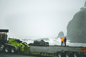 Workers with Bruch and Bruch Construction of Port Angeles and the Army Corps of Engineers scurry to place protective rock called rip rap along the LaPush waterfront Friday. Emily Foster/The Talking Raven